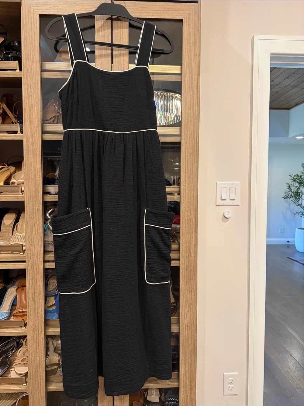Kerri Rosenthal black gauzy dress with side pockets and front pockets.